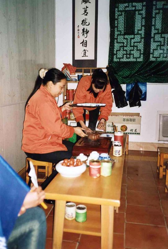9 - East jet staff giving a graceful demonstration of the Chinese tea ceremony.jpg